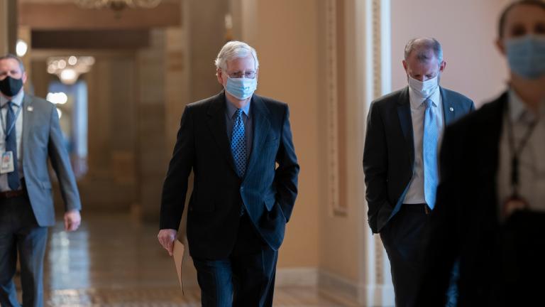On the first full day of the new Democratic majority in the Senate, Sen. Mitch McConnell, R-Ky., the top Republican, walks to the chamber for the start of business as the minority leader, at the Capitol in Washington, Thursday, Jan. 21, 2021. (AP Photo / J. Scott Applewhite)