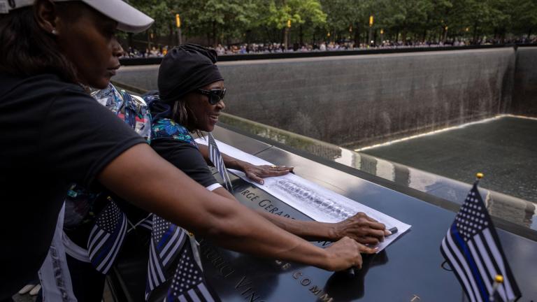 Family members gather around the 9/11 Memorial during the commemoration ceremony on the 22nd anniversary of the September 11, 2001, terror attacks on Monday, Sept. 11, 2023, in New York. (AP Photo/Yuki Iwamura)