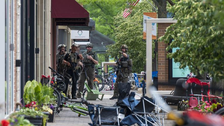 Local, State and Federal police work the scene of a mass shooting at a Fourth of July parade in Highland Park, Ill., Monday, July 4, 2022. (Tyler Pasciak LaRiviere / Chicago Sun-Times via AP)