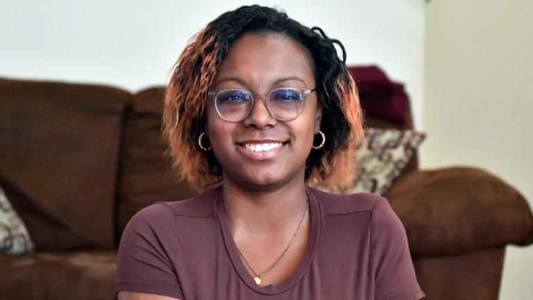 Jalen Matthews sits on her yoga mat in her home in Louisville, Ky., Monday, Dec. 4, 2023. She was diagnosed with sickle cell at birth and had her first pain crisis at age 9. Three years later, the disease led to a spinal cord stroke that left her with some paralysis in her left arm and leg. “I had to learn how to walk again, feed myself, clothe myself, basically learn how to do everything all over again,” said Matthews, who is now 26. (Timothy D. Easley / AP Photo)