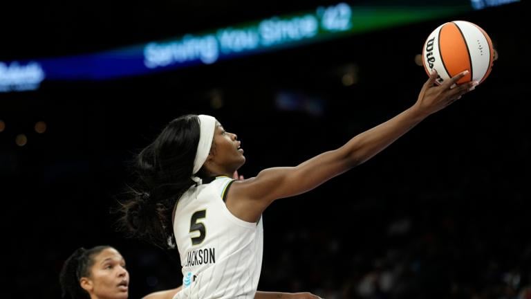 Chicago Sky forward Rickea Jackson (5) drives past Phoenix Mercury forward Alyssa Thomas to score during the second half of a WNBA basketball game, Friday, May 15, 2026, in Phoenix. (AP Photo / Ross D. Franklin)