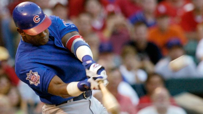 Chicago Cubs' Sammy Sosa connects for a three-run home run in the third ining against the St. Louis Cardinals Sunday, July 11, 2004 at Busch Stadium in St. Louis. (AP Photo / Tom Gannam, File)