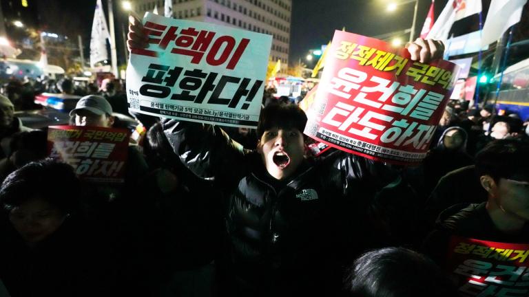 A man shouts to demand South Korean President Yoon Suk Yeol to step down in front of the National Assembly in Seoul, South Korea, Wednesday, Dec. 4, 2024. (Ahn Young-joon / AP Photo)