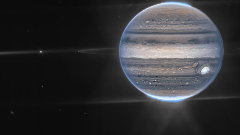 This image provided by NASA shows a false color composite image of Jupiter obtained by the James Webb Space Telescope on July 27, 2022. The planet’s rings and some of its small satellites are visible along with background galaxies. (NASA via AP)