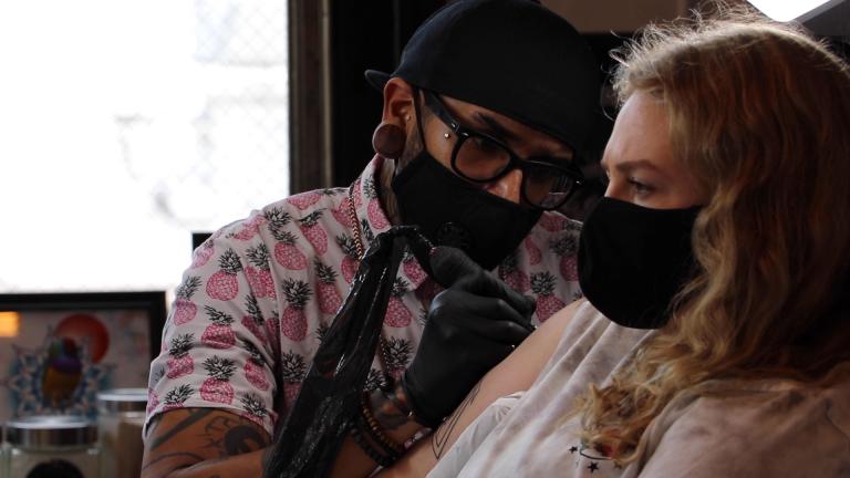 Marta Slobodyanyuk is tattooed by artist Gady Mercado at Speakeasy Custom Tattoos in Chicago’s Wicker Park neighborhood on June 22, 2020. (Evan Garcia / WTTW News)