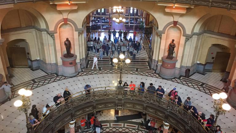 Protesters demanding a budget block Gov. Bruce Rauner’s office on Tuesday. (Amanda Vinicky / Chicago Tonight)