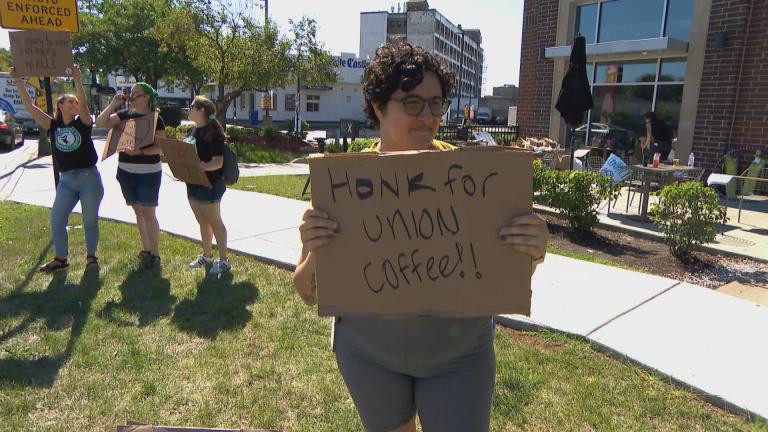  A Starbucks worker in Edgewater participates in a one-day strike on Aug. 30, 2022. (WTTW News)