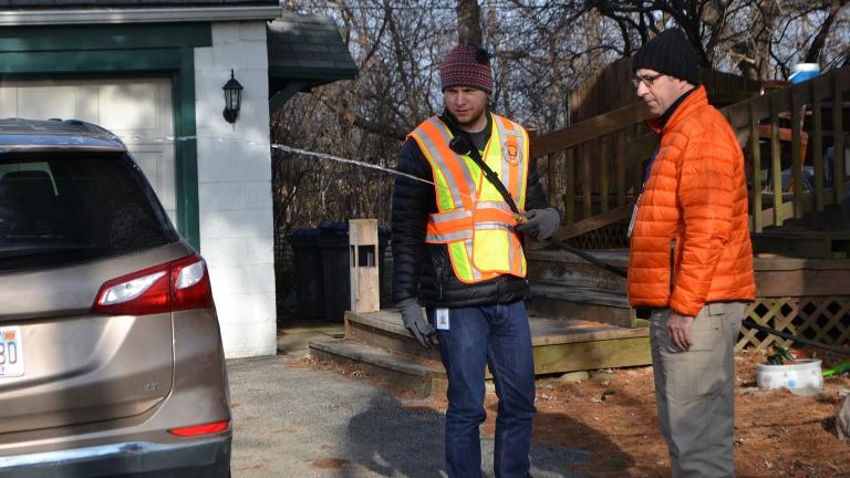 John Berg, an environmental health specialist with the DuPage County Health Department, runs water from a private well in Willowbrook on Dec. 13, 2018, as part of testing for levels of cancer-causing ethylene oxide. (Alex Ruppenthal / WTTW)