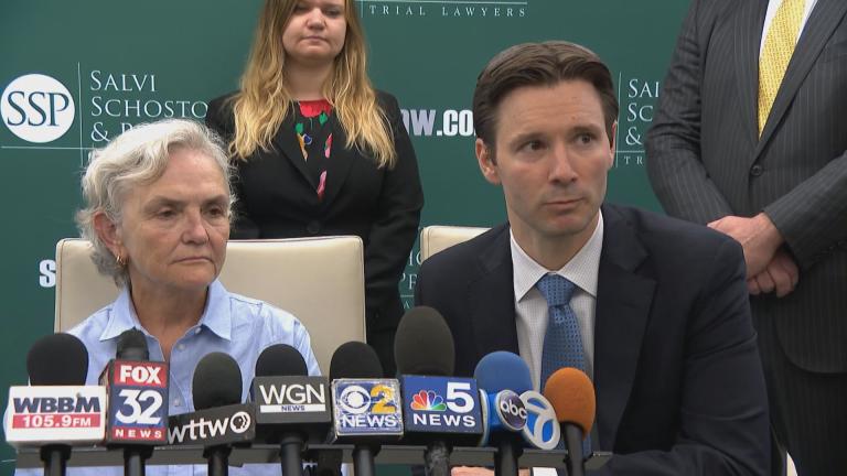 Sue Kamuda and her attorney Patrick Salvi II appear at a news conference after she was awarded $363 million from Sterigenics on Sept. 19, 2022. (WTTW News)