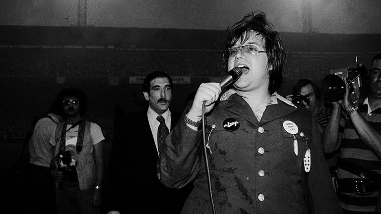 American disc jockey Steve Dahl walks down a staircase during an