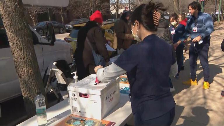 A UChicago Medicine nurse submits ballot in strike authorization vote held on Feb. 20 in Hyde Park. The union National Nurses United represents 2,800 nurses at UChicago Medicine. (WTTW News)