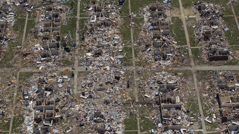 Debris covers the ground in the aftermath of a tornado in Tuscaloosa, Ala., May 7, 2011. Meteorologists are warning of a series of severe storms that could rip across America’s Midwest and South over the next couple of weeks. (AP Photo/Dave Martin, File)
