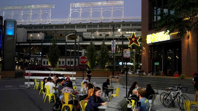 Patrons at the Big Star Wrigleyville restaurant Friday, Sept. 4, 2020, are seated in a social distant manner on West Patterson Ave., across from Wrigley Field during a baseball game between the Cubs and St Louis Cardinals in Chicago. (AP Photo / Charles Rex Arbogast)