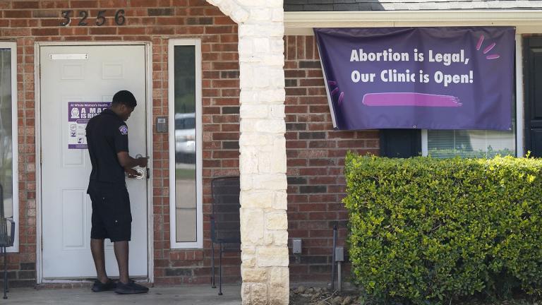 A security guard opens the door to the Whole Women’s Health Clinic in Fort Worth, Texas, Wednesday, Sept. 1, 2021. (AP Photo / LM Otero)