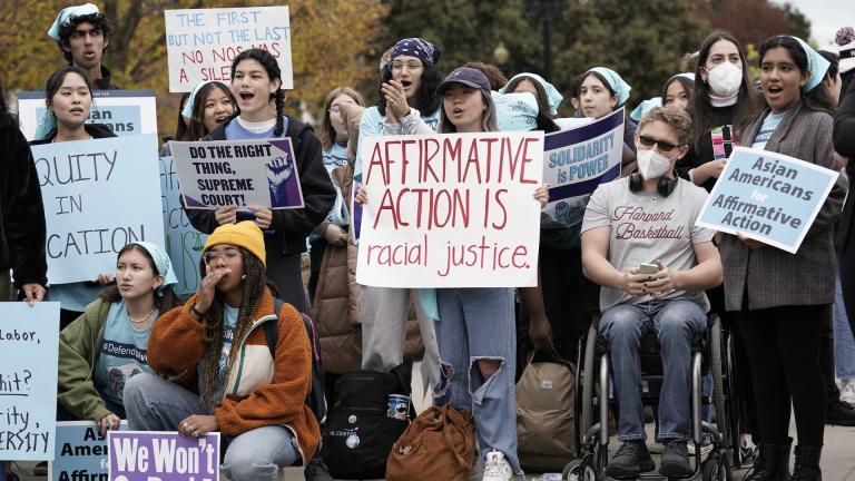 People rally outside the Supreme Court as the court begins to hear oral arguments in two cases that could decide the future of affirmative action in college admissions, Monday, Oct. 31, 2022, in Washington. (AP Photo/J. Scott Applewhite)