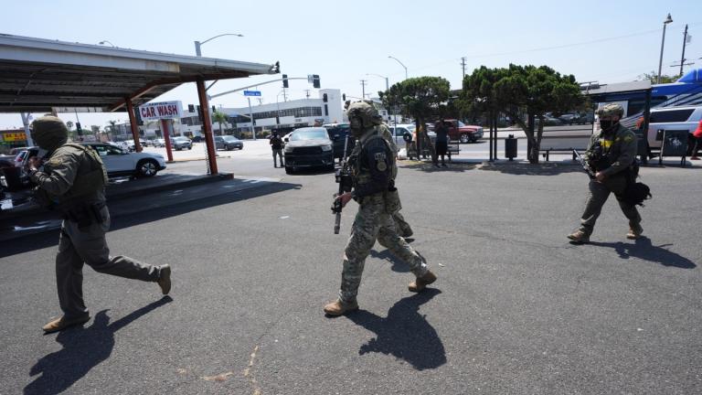 Immigration agents conduct an operation at a car wash Aug. 15, 2025, in Montebello, Calif. (AP Photo / Gregory Bull, File)