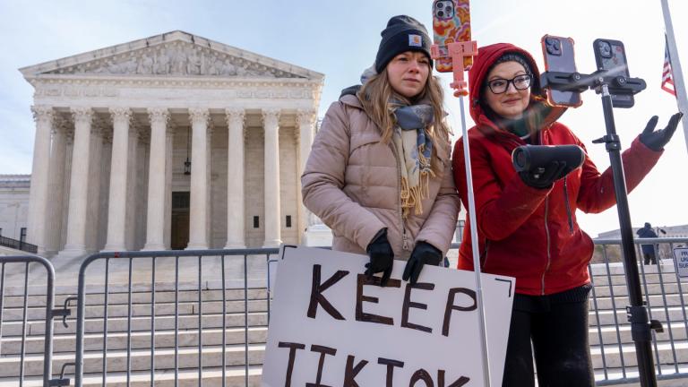 Sarah Baus, left, of Charleston, S.C., and Tiffany Cianci, who says she is a "long-form educational content creator," livestream to TikTok outside the Supreme Court, on Jan. 10, 2025, in Washington. (AP Photo / Jacquelyn Martin, File)
