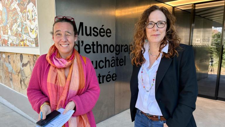 Marianne de Reynier Nevsky, the cultural mediation manager in Neuchatel, left, and town council member Julie Courcier Delafontaine chat about a new "museum prescription" program outside the Ethnographic Museum of Neuchatel in Neuchatel, Switzerland, Wednesday, March 19, 2025. (Jamey Keaton / AP Photo)