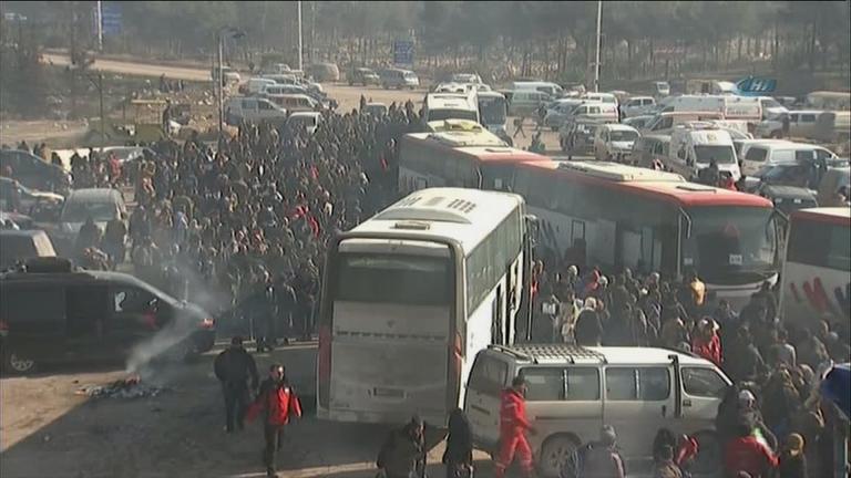 Refugees stream out of Aleppo, Syria. (Courtesy of CNN)