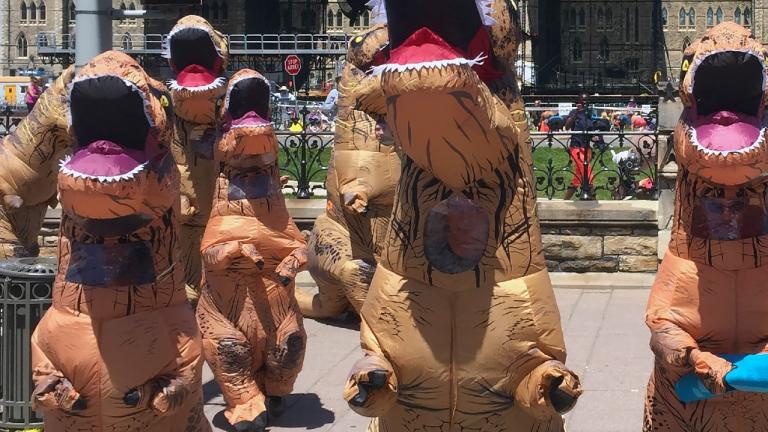 Competitors in costumes like the ones pictured will race in Saturday's Dino Derby at the Field Museum. (Paul McKinnon / iStock)