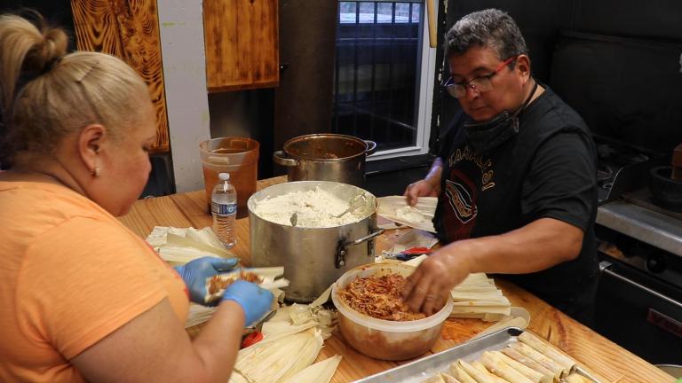 Claudio Velez makes pork tamales with his sister Maria in Velez’s new restaurant Tamale Guy Chicago on Aug. 13, 2020. (Evan Garcia / WTTW News)
