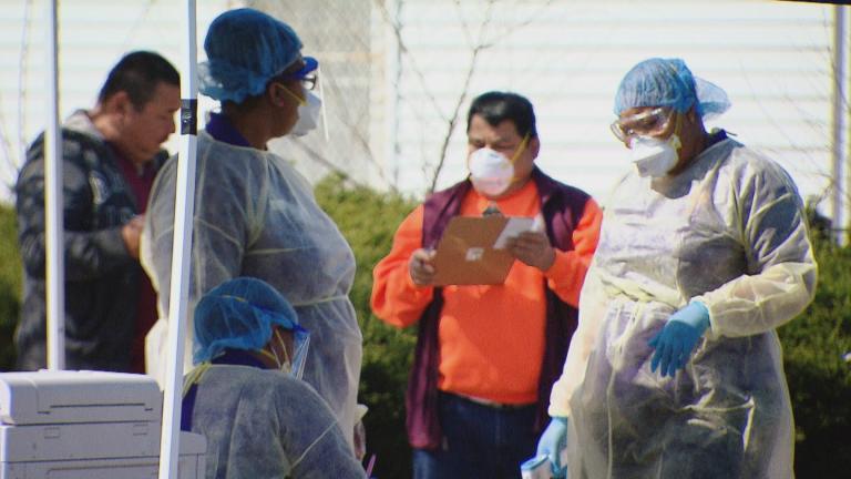 A file photo of workers at a COVID-19 testing site. (WTTW News)