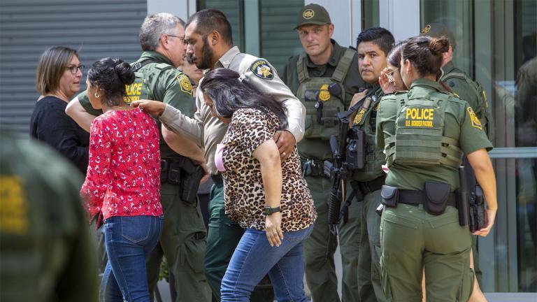 People leave the Uvalde Civic Center following a shooting earlier in the day at Robb Elementary School, Tuesday, May 24, 2022, in Uvalde, Texas. (William Luther / The San Antonio Express-News via AP)