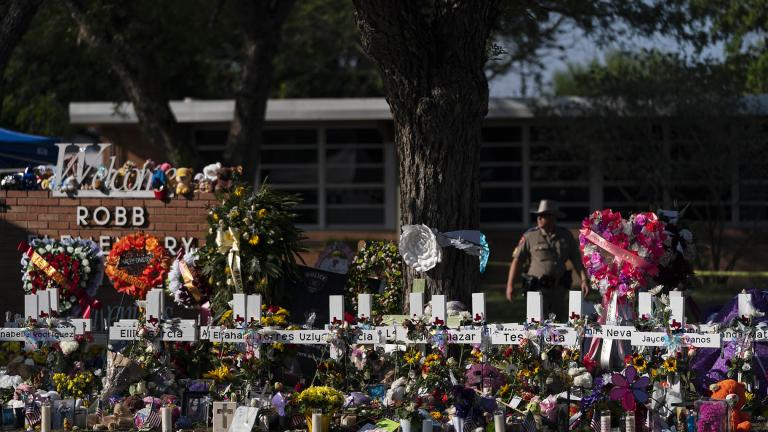 Flowers and candles are placed around crosses at a memorial outside Robb Elementary School to honor the victims killed in this week's school shooting in Uvalde, Texas Saturday, May 28, 2022. (AP Photo / Jae C. Hong, File)