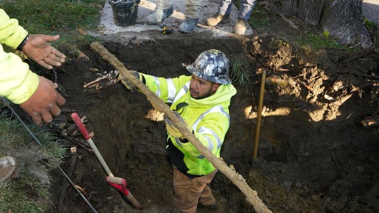 A cut lead pipe is pulled from a dig site for testing at a home in Royal Oak, Mich., on Nov. 16, 2021. The Environmental Protection Agency will soon strengthen lead in drinking water regulations. (AP Photo / Carlos Osorio, File)