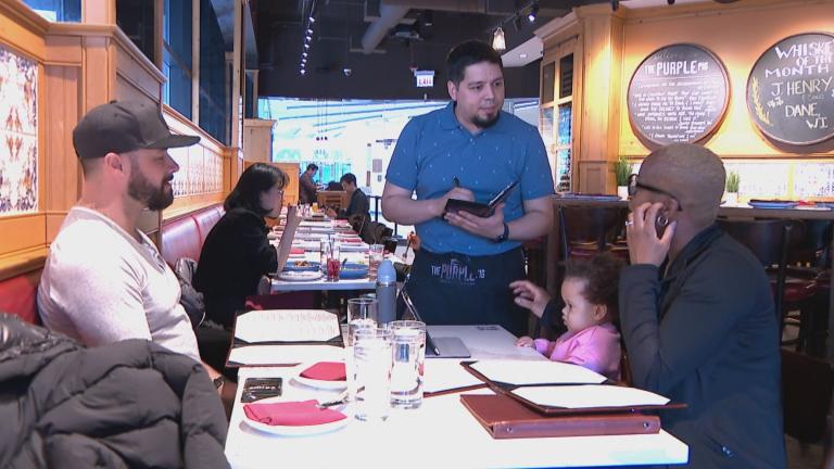 A server working in a restaurant. (WTTW News)