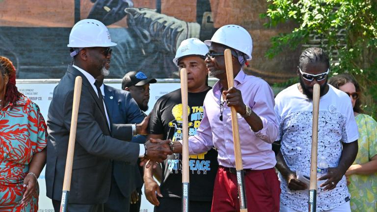 Chicago police torture survivor Stanley John Howard, right, shakes hands with Mayor Brandon Johnson, left, during a groundbreaking ceremony for the Chicago Torture Justice Memorial at 5520 S. King Drive in Washington Park on July 8, 2026. (Victor Hilitski / WTTW News)