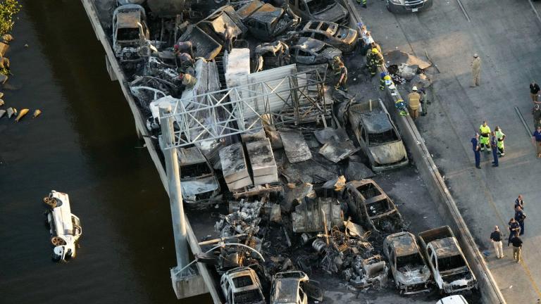 In this aerial photo, responders are seen near wreckage in the aftermath of a fatal, multi-vehicle pileup on I-55 in Manchac, La., Oct. 23, 2023. (AP Photo / Gerald Herbert, File)
