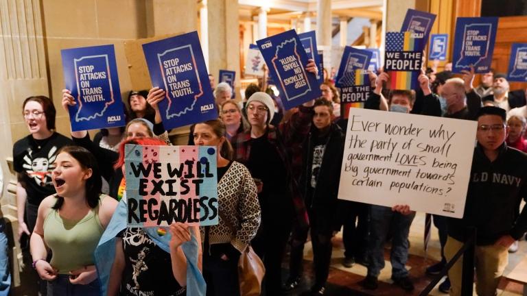 Protesters stand outside of the Senate chamber at the Indiana Statehouse, Feb. 22, 2023, in Indianapolis. On Tuesday, Feb. 27, 2024, a federal appeals court in Chicago stayed an injunction from an Indiana district court that blocked most of the state’s ban on gender-affirming care for minors, allowing the ban to take effect. (AP Photo / Darron Cummings, File)