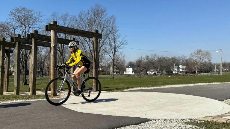 A cyclist rides along the Cardinal Greenway in Muncie, Indiana, March 13, 2024. (AP Photo / Isabella Volmert, File)