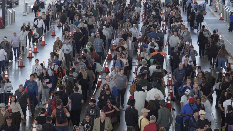 Travelers line up at a TSA checkpoint at George Bush Intercontinental Airport in Houston, Thursday, March 26, 2026. (AP Photo / Lekan Oyekanmi)