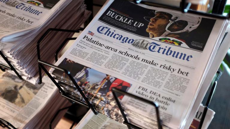 In this Monday, April 25, 2016, file photo, Chicago Tribune and other newspapers are displayed at Chicago's O’Hare International Airport. (AP Photo / Kiichiro Sato, File)