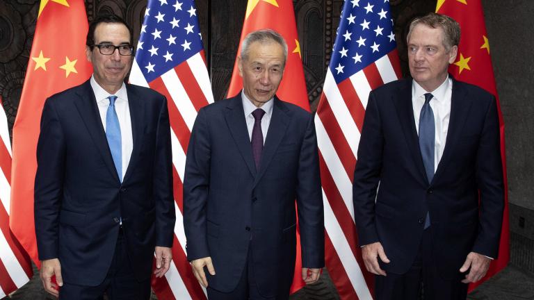 Chinese Vice Premier Liu He, center, poses with U.S. Trade Representative Robert Lighthizer, right, and Treasury Secretary Steven Mnuchin, for photos before holding talks at the Xijiao Conference Center in Shanghai Wednesday, July 31, 2019. (AP Photo/Ng Han Guan, Pool)