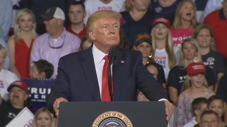 Attendees at a rally in North Carolina for President Donald Trump chant “Send her back” as Trump watches on. 