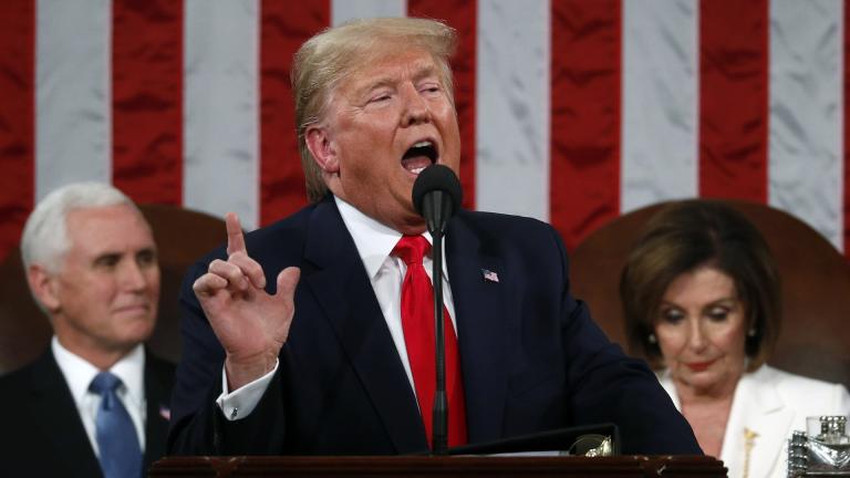 President Donald Trump delivers his State of the Union address to a joint session of Congress in the House Chamber on Capitol Hill in Washington, Tuesday, Feb. 4, 2020, as Vice President Mike Pence and Speaker Nancy Pelosi look on. (Leah Millis / Pool via AP)