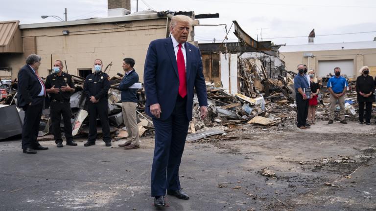 President Donald Trump tours an area on Tuesday, Sept. 1, 2020, damaged during demonstrations after a police officer shot Jacob Blake in Kenosha, Wis. (AP Photo/Evan Vucci)