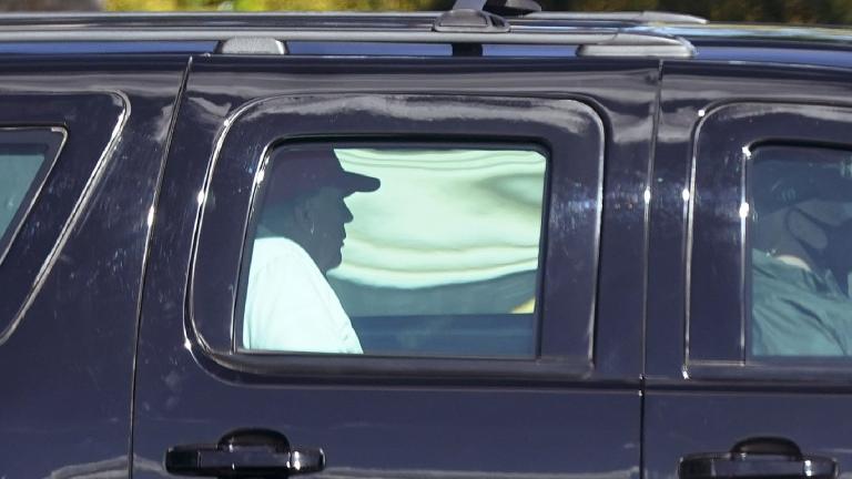President Donald Trump rides in a motorcade vehicle as he departs Trump International Golf Club, Sunday, Dec. 27, 2020, in West Palm Beach, Fla. (AP Photo / Patrick Semansky)