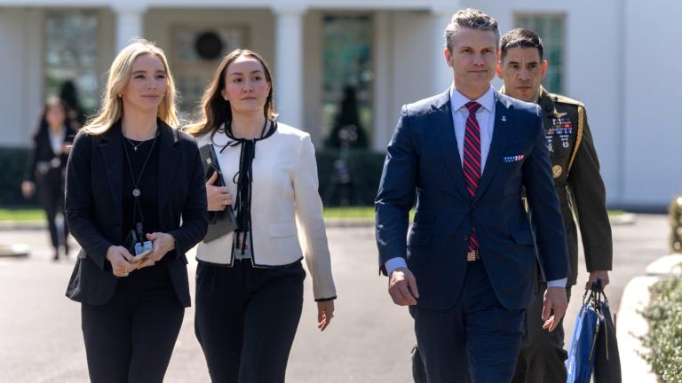 Defense Secretary Pete Hegseth, second from right, walks outside the Oval Office at the White House, Friday, March 21, 2025, in Washington. (AP Photo / Mark Schiefelbein)