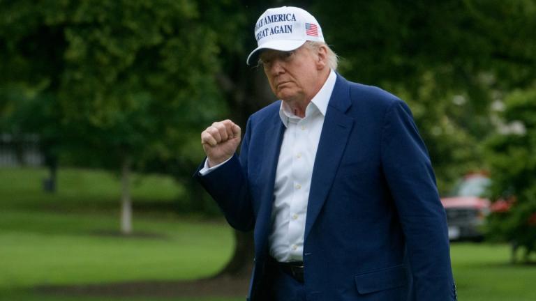 President Donald Trump acknowledges reporters as he disembarks Marine One upon arrival on the South Lawn of the White House in Washington, Sunday, May 25, 2025. (AP Photo / Rod Lamkey, Jr.)