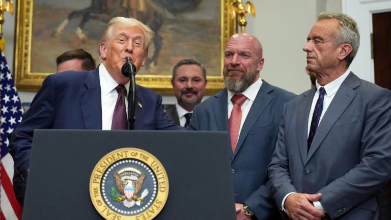 President Donald Trump, from left, speaks as Cody Campbell, WWE CCO Triple H and Health and Human Services Secretary Robert F. Kennedy Jr. listen during an event for the signing of an executive order restarting the Presidential Fitness Test in public schools, Thursday, July 31, 2025, in the Roosevelt Room of the White House in Washington. (Jacquelyn Martin / AP Photo)