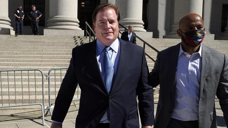 Chicago banker Stephen Calk, left, leaves federal court in New York, June 24, 2021. (AP Photo / Richard Drew, File)