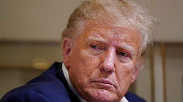 Former President Donald Trump listens as he speaks with reporters while in flight on his plane after a campaign rally at Waco Regional Airport, in Waco, Texas, March 25, 2023, while en route to West Palm Beach, Fla. (AP Photo / Evan Vucci, File)