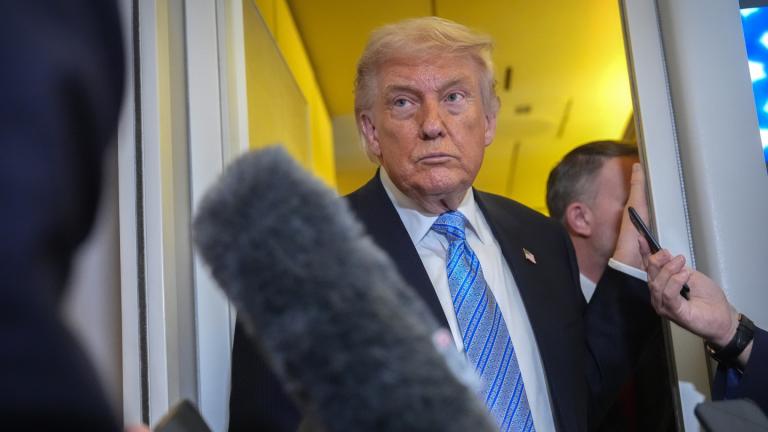 President Donald Trump speaks to reporters aboard Air Force One, Friday, May 15, 2026, as he returns from a trip to Beijing, China. (AP Photo / Mark Schiefelbein)