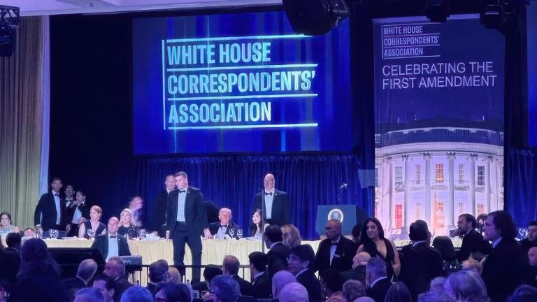 U.S. Secret Service agents surround President Donald Trump as he is taken from the stage after a shooting incident outside the ballroom during the White House Correspondents Dinner, Saturday, April 25, 2026, in Washington. (AP Photo / Alex Brandon)