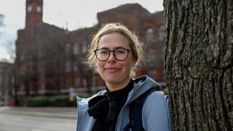 Sydney Smith, who lost her job due to DOGE cuts, stands in front of the Sydney Yates building that houses the Forest Service on Thursday, March. 6, 2025, in Washington. (AP Photo / John McDonnell)