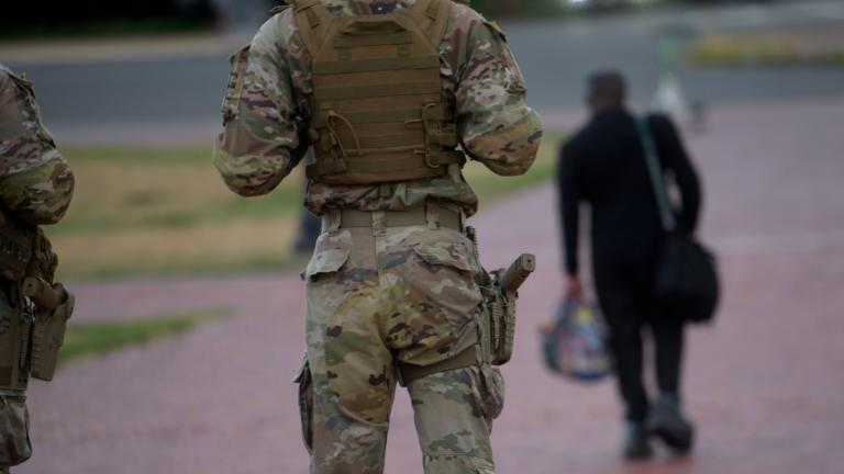 Armed members of the South Carolina National Guard talk with a man while positioned outside of Union Station in Washington, Sunday, Aug. 24, 2025. (AP Photo / Rod Lamkey, Jr.)